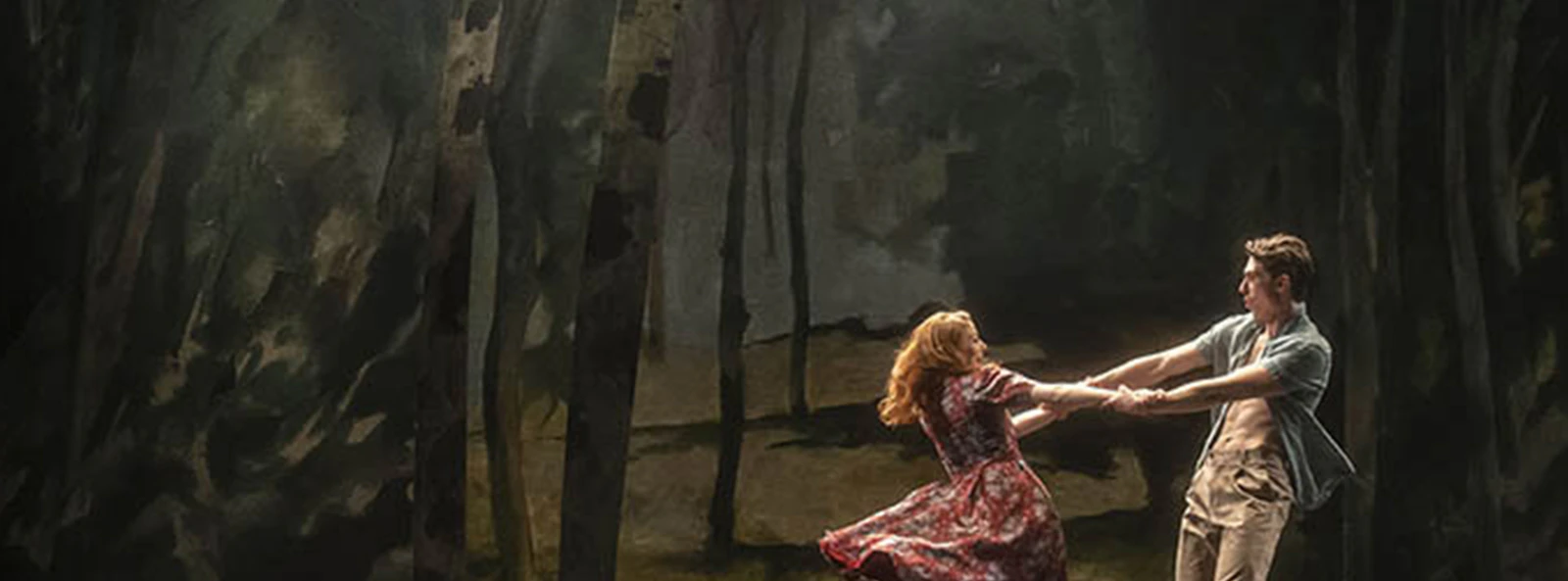 Dancers performing in a forest-themed set for "Aspects of Love" show.