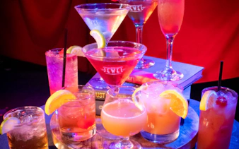 Cocktails on a table at a 1920s-themed speakeasy dinner show in Orlando.