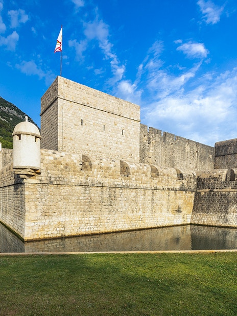 Walls of Ston in Croatia with stone fortifications and surrounding landscape.