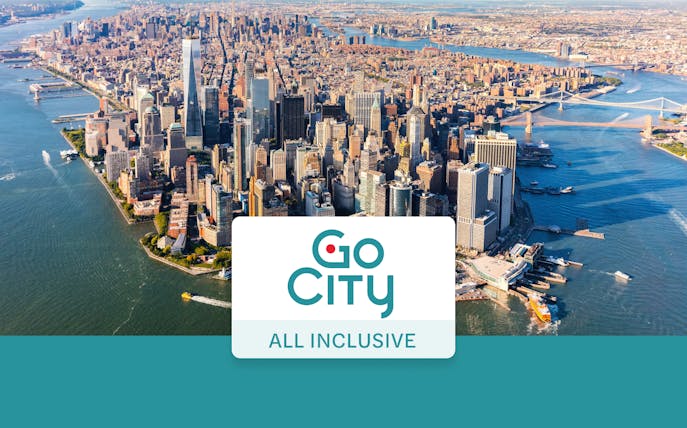 Aerial view of Manhattan skyline with Go City New York Pass logo.