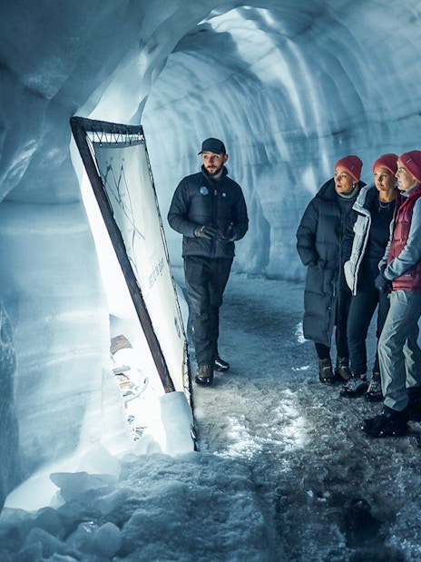 Guests with tour guide inside Langjokull ice tunnels in Iceland.