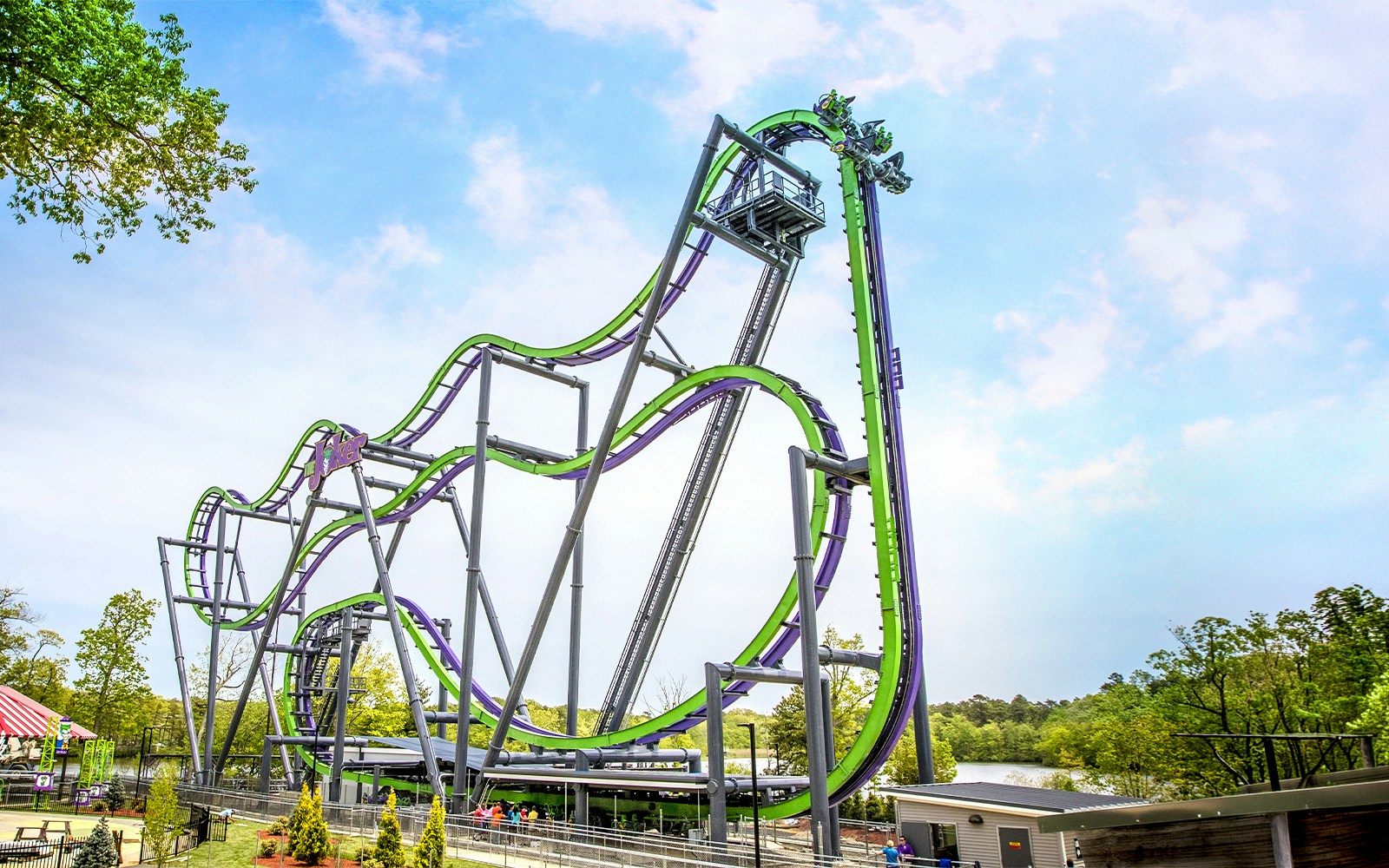 THE JOKER™ rollercoaster at Six Flags Great Adventure with green and purple tracks.