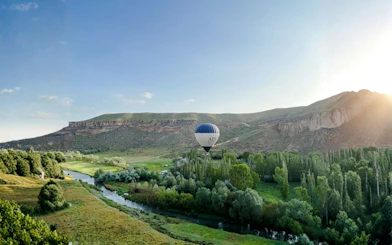 Hot air balloon over Ihlara Canyon at sunrise, Cappadocia.