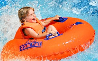 Child enjoying a water ride at Sesame Place San Diego.