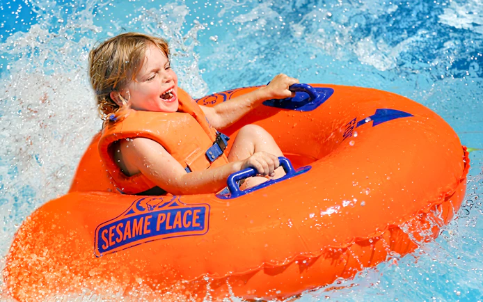 Child enjoying a water ride at Sesame Place San Diego.