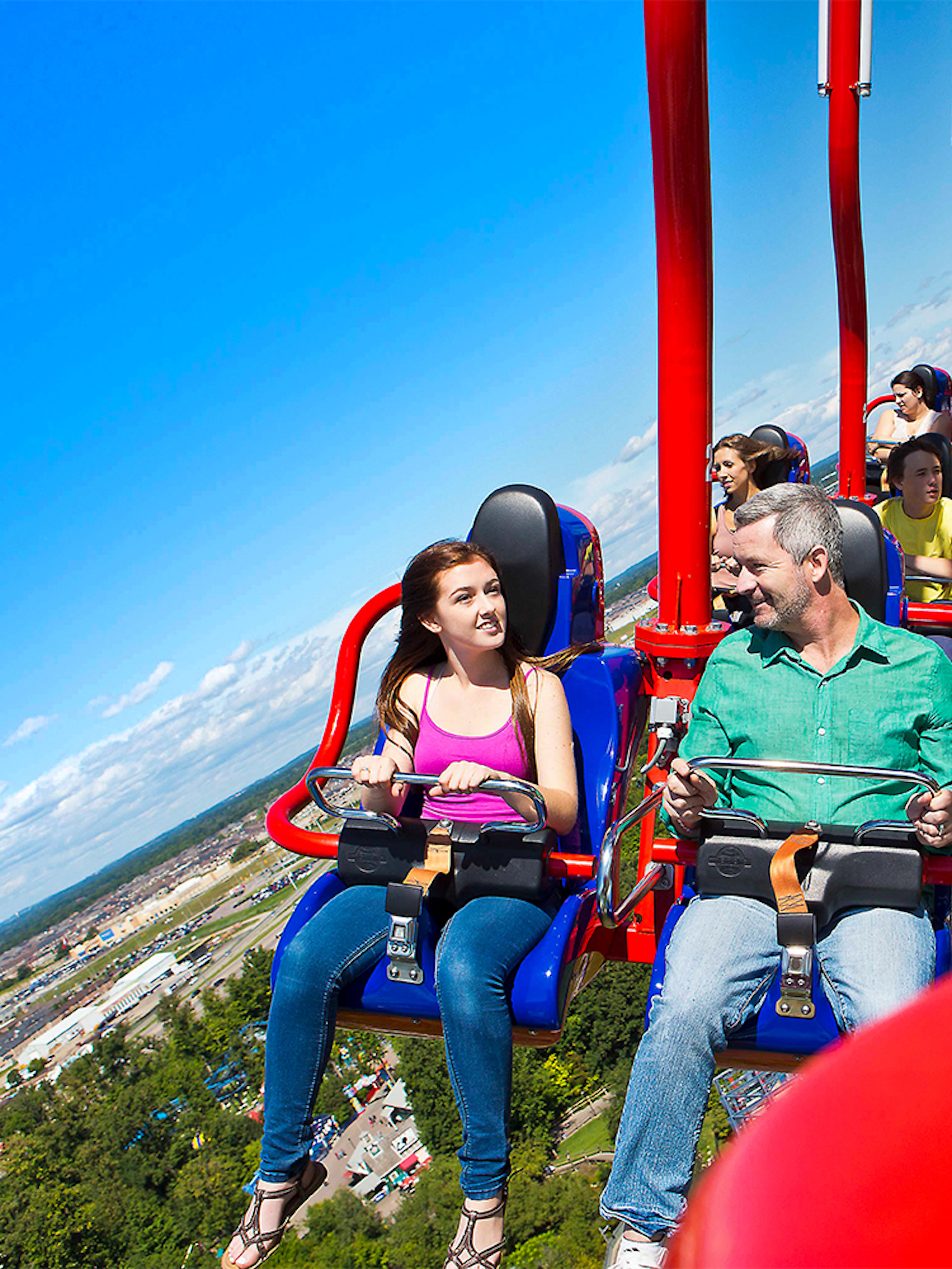 Riders on WindSeeker at Canada's Wonderland with park view.
