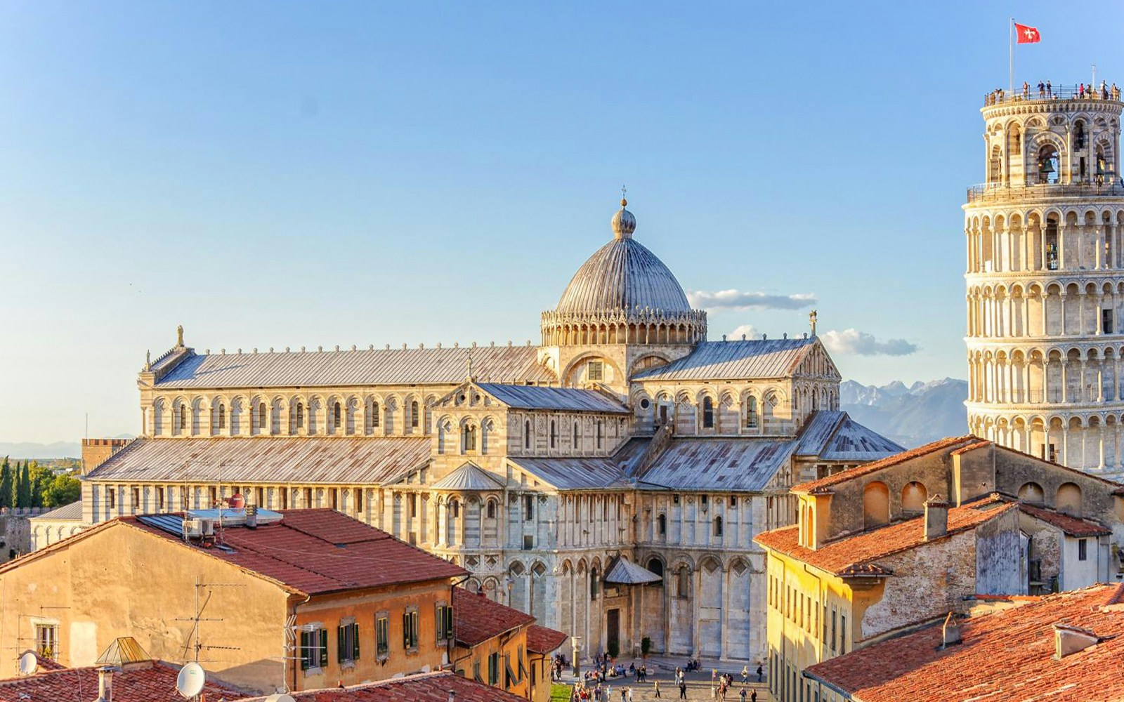 Aerial view of the Pisa Cathedral and the famous Leaning tower during golden hour
