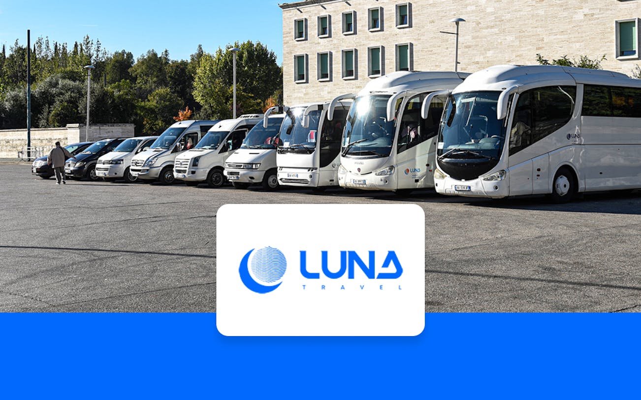 Buses parked at Tirana Airport for transfer to Tirana Central.