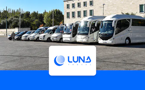 Buses parked at Tirana Airport for transfer to Tirana Central.