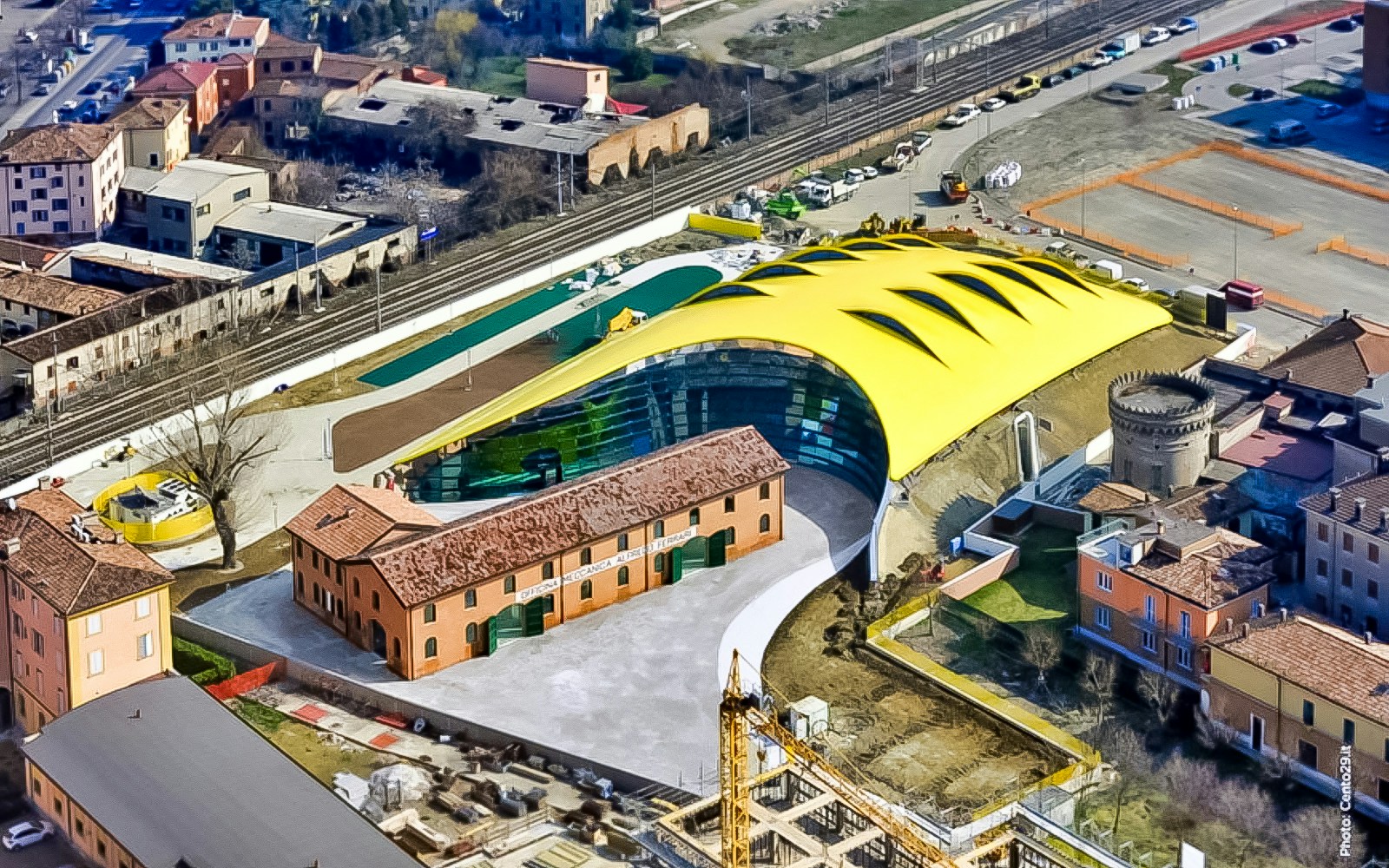 Aerial view of Museo Enzo Ferrari Modena with its distinctive yellow roof.