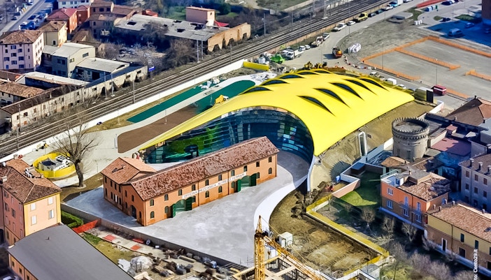 Aerial view of Museo Enzo Ferrari Modena with its distinctive yellow roof.