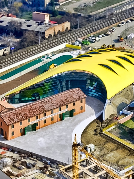 Aerial view of Museo Enzo Ferrari Modena with its distinctive yellow roof.