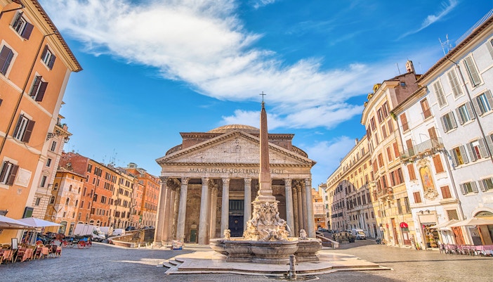 Roman Pantheon exterior with tourists exploring the ancient architecture in Rome, Italy.