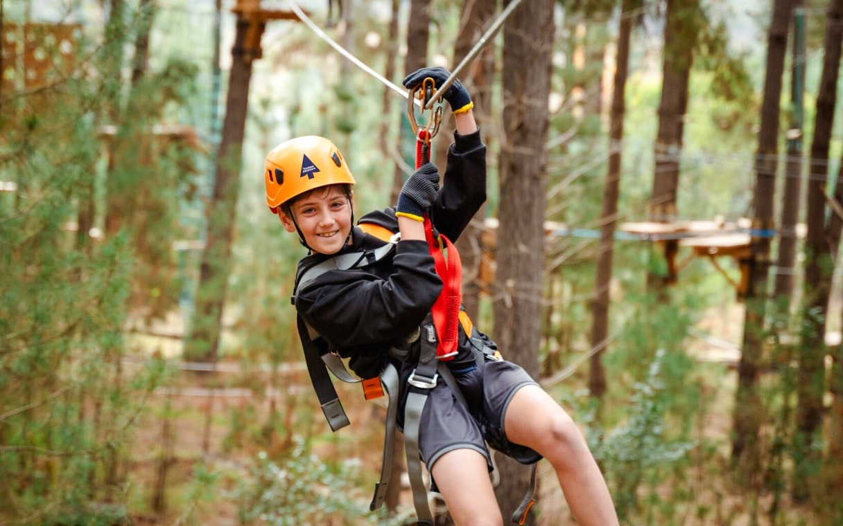 Child ziplining through Daintree Rainforest, Australia.