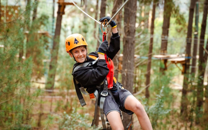 Child ziplining through Daintree Rainforest, Australia.