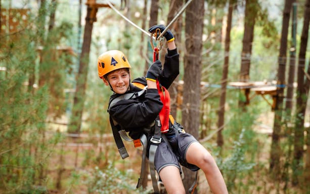 Child ziplining through Daintree Rainforest, Australia.