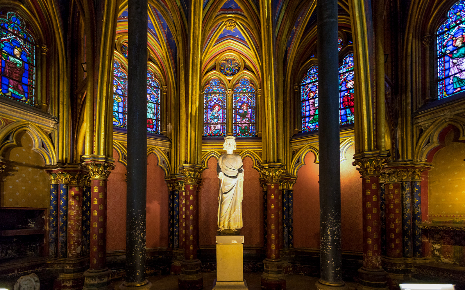 Notre Dame Cathedral Paris statues detail with intricate carvings and historical figures.