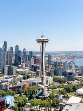 Aerial view of Seattle's Space Needle with city skyline and waterfront.