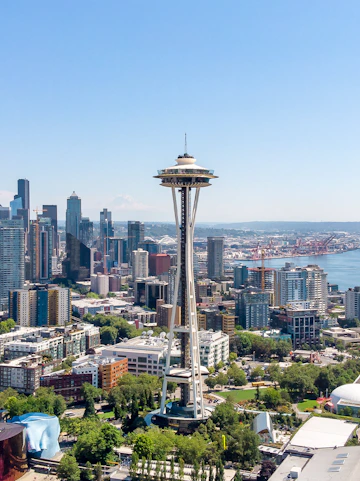 Aerial view of Seattle's Space Needle with city skyline and waterfront.