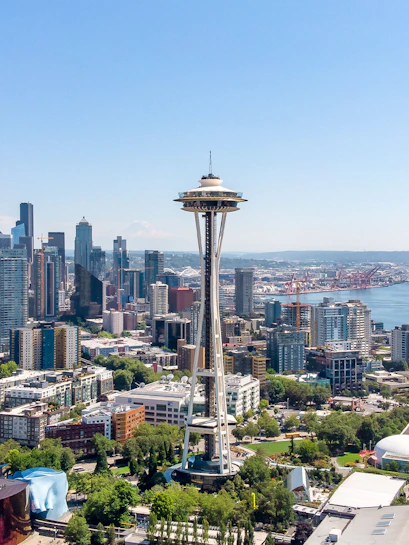 Aerial view of Seattle's Space Needle with city skyline and waterfront.