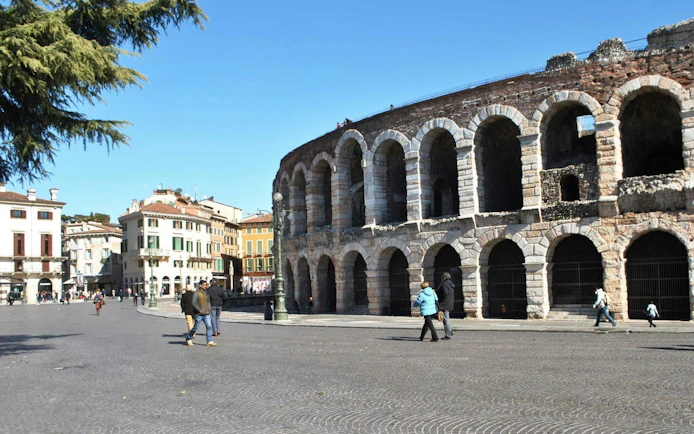 Verona Arena with surrounding plaza and nearby buildings in Verona, Italy.