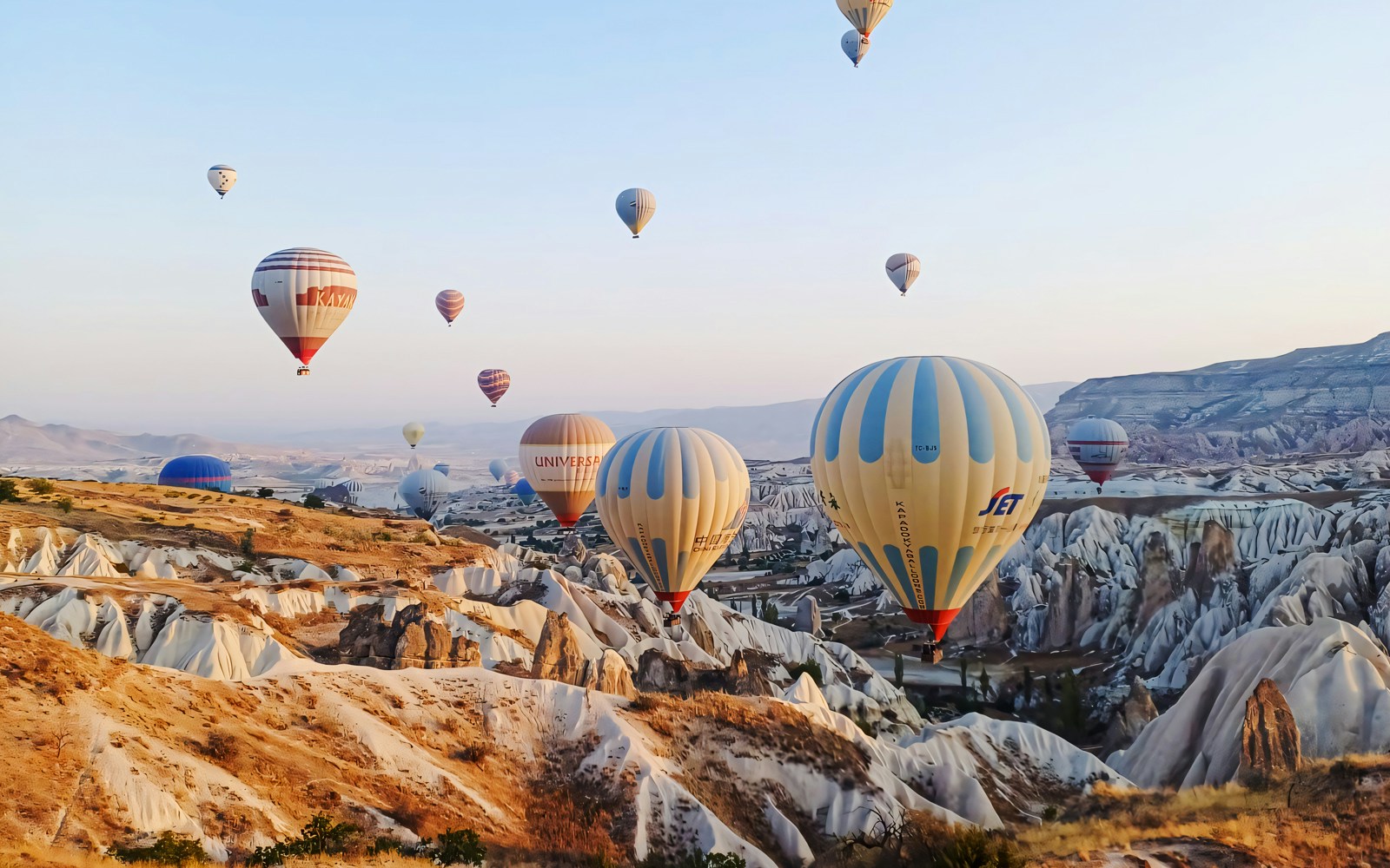Hot air balloons over Cappadocia's unique rock formations, Turkey.