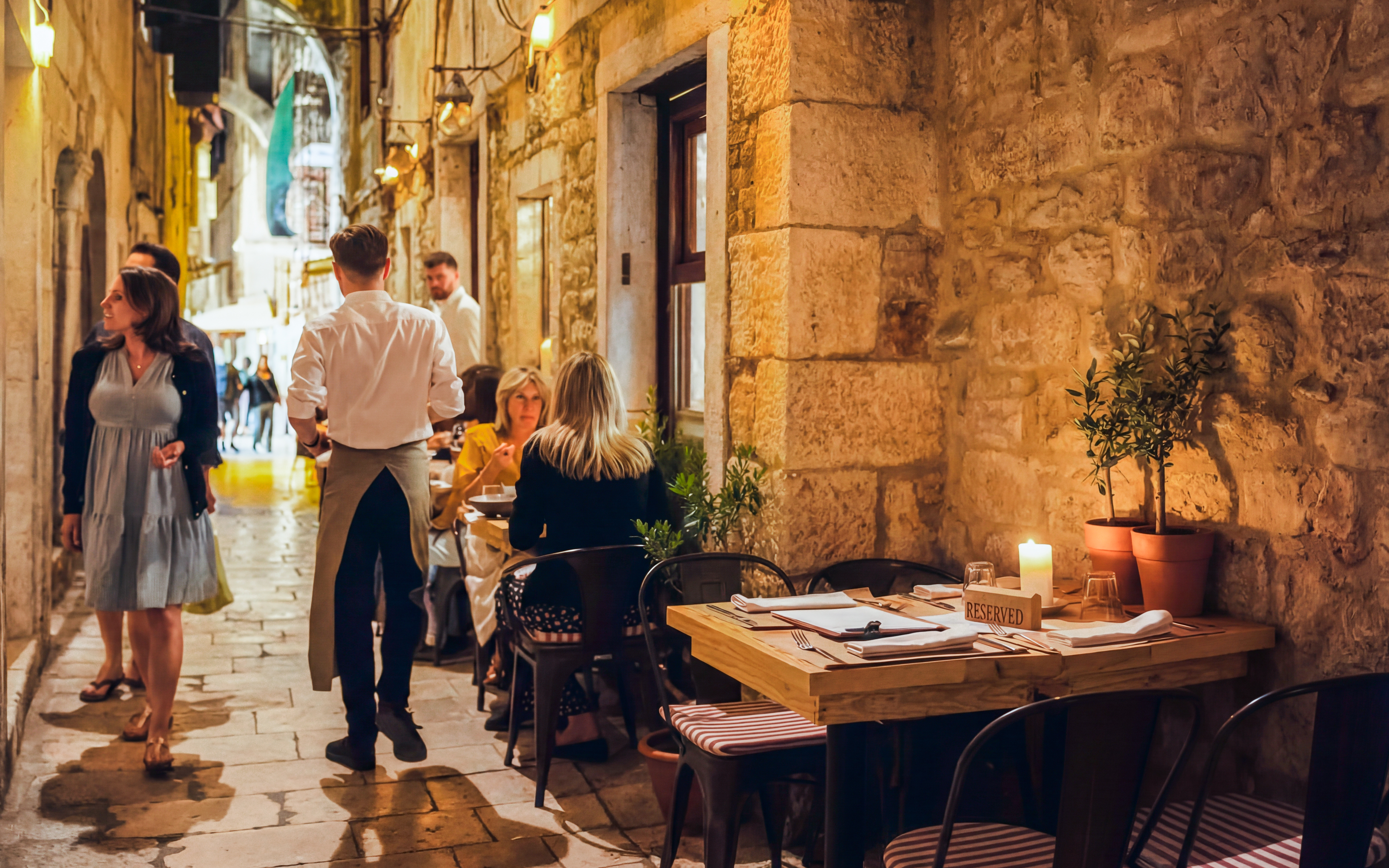 Wine tasting setup in a historic alley of Diocletian’s Palace, Split, Croatia.