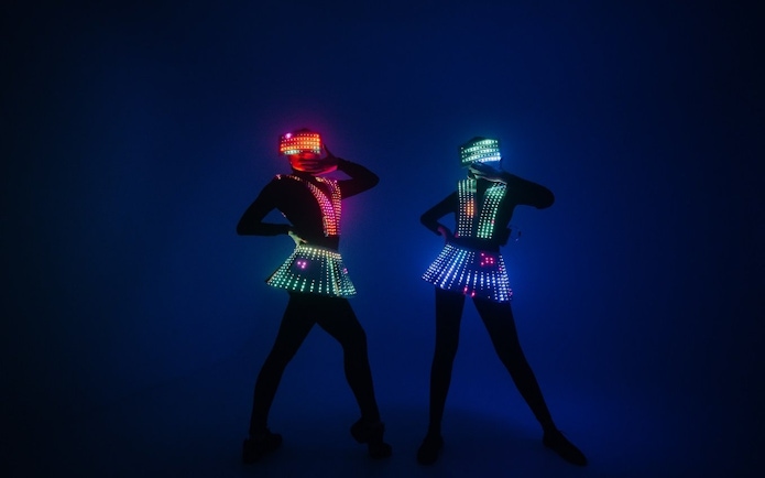 Performers in LED costumes at Night Splash, SplashMania Waterpark.