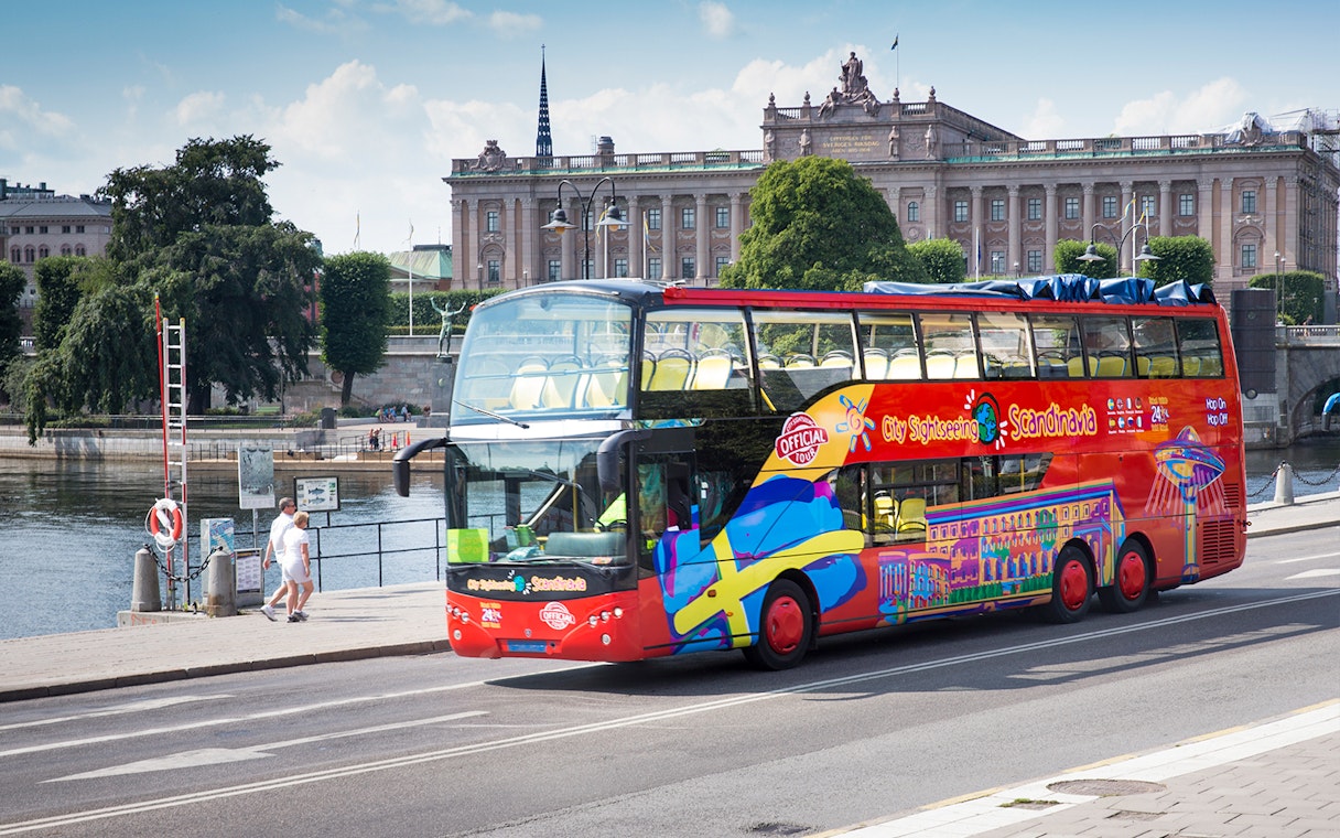 Open-top tour bus in Stockholm near the Royal Palace.