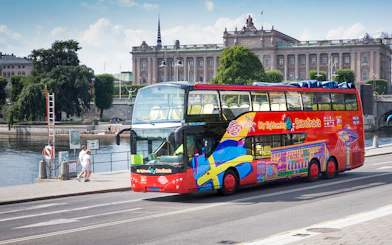 Open-top tour bus in Stockholm near the Royal Palace.