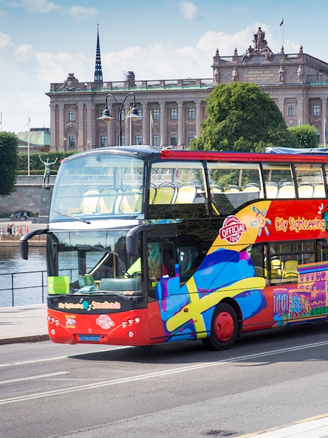 Open-top tour bus in Stockholm near the Royal Palace.