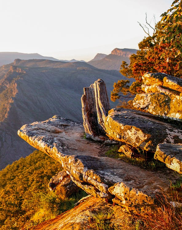 Rocky cliff edge at sunset in Grampians National Park, Australia.