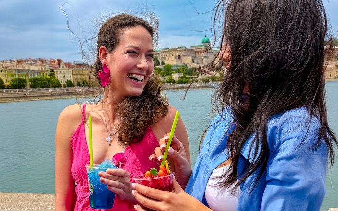 Guests enjoying slushies on Budapest Danube River sightseeing cruise.
