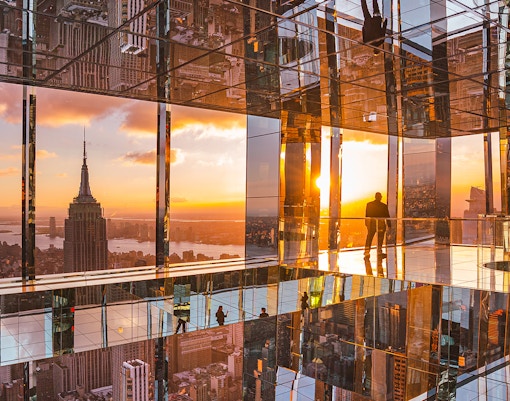 Summit One Vanderbilt New York sunset view with city skyline in the background.