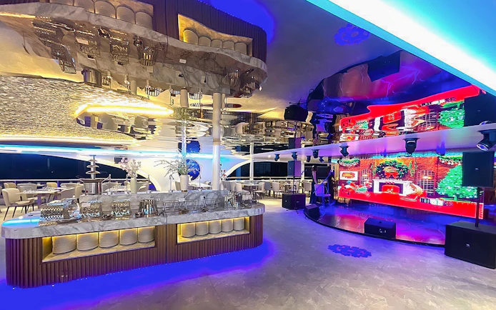 Luxurious dining area with modern decor on the Royal Galaxy Cruise.
