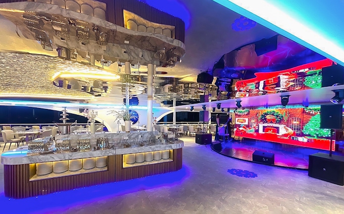 Luxurious dining area with modern decor on the Royal Galaxy Cruise.