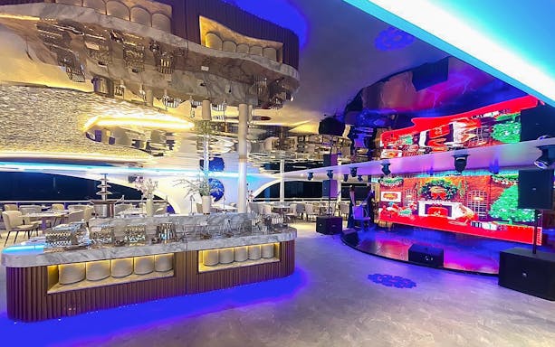 Luxurious dining area with modern decor on the Royal Galaxy Cruise.