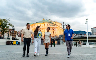 Group walking near Bilbao's Arriaga Theater during Guggenheim and Gaztelugatxe tour.