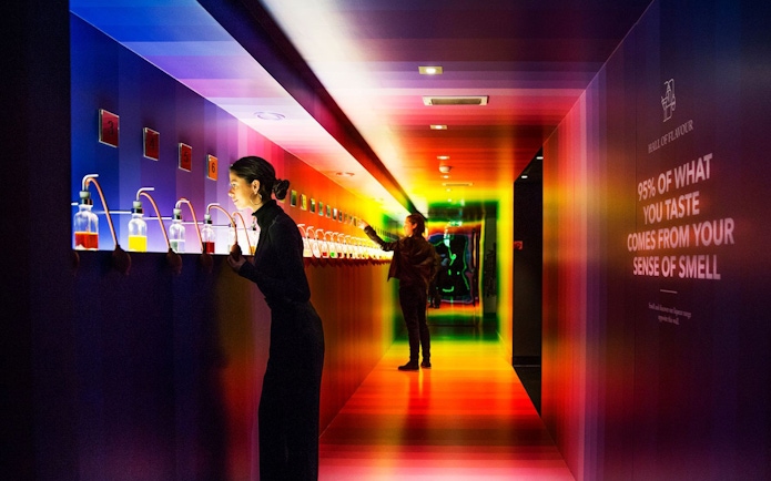 Visitors exploring interactive scent displays at Amsterdam House of Bols.