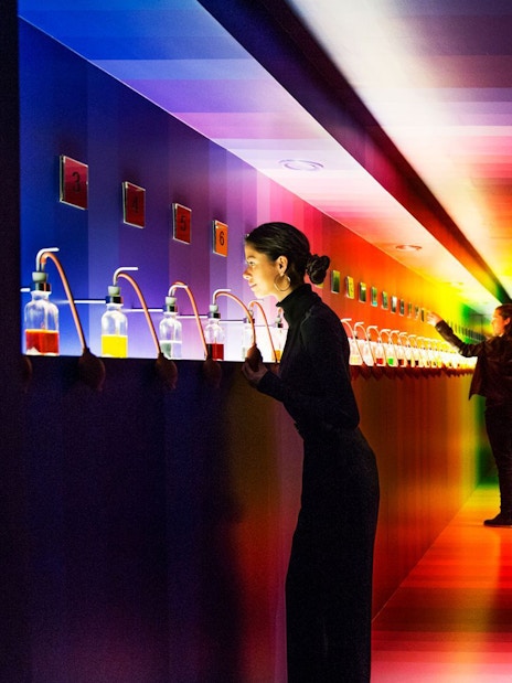 Visitors exploring interactive scent displays at Amsterdam House of Bols.