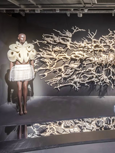 Mannequins in intricate designs at ArtScience Museum exhibit, Singapore.