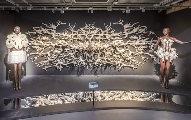 Mannequins in intricate designs at ArtScience Museum exhibit, Singapore.