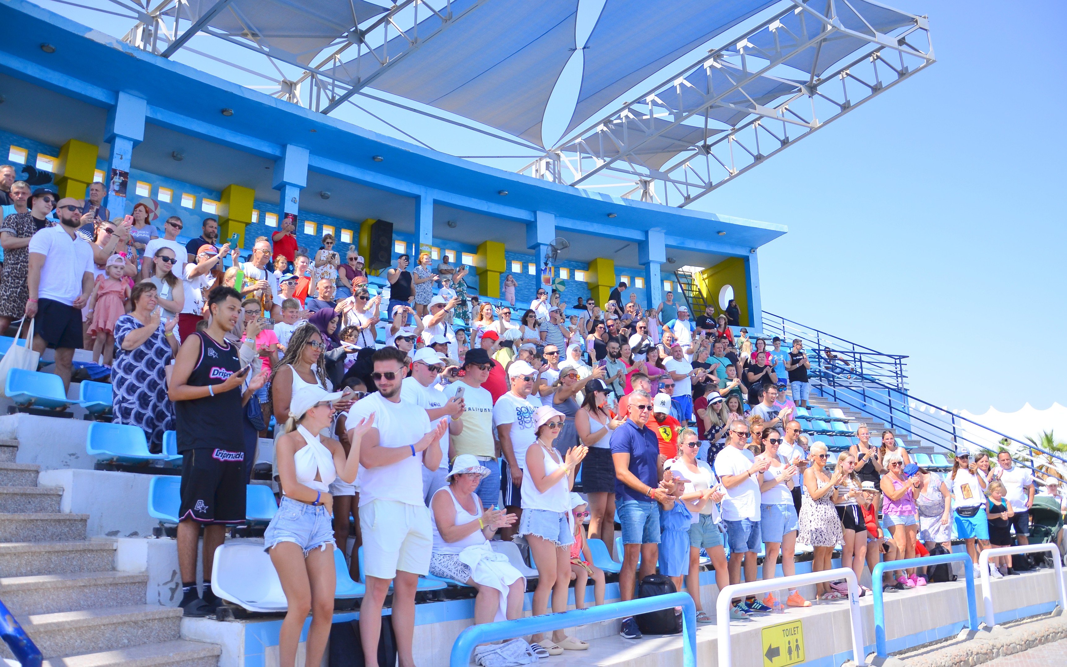 Audience giving standing ovation at Egypt Dolphin World, Hurghada.