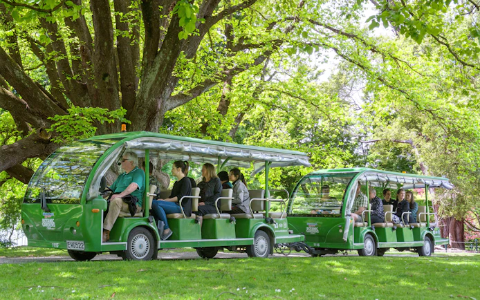 Tour group on electric shuttle in Christchurch Botanic Gardens.