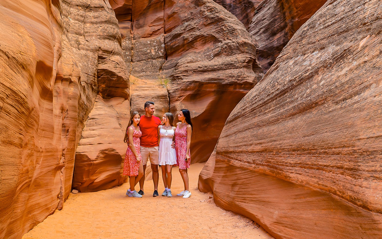 Group exploring Antelope Valley Canyon's sandstone formations on Ligai Si Anii Tour.