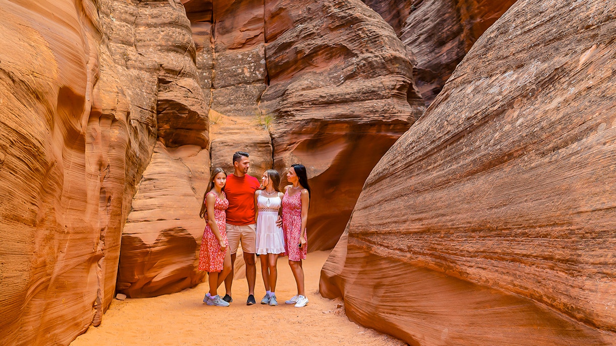 Group exploring Antelope Valley Canyon's sandstone formations on Ligai Si Anii Tour.