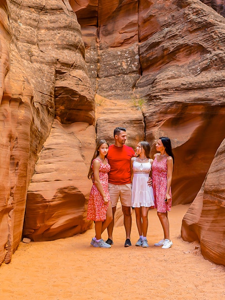 Group exploring Antelope Valley Canyon's sandstone formations on Ligai Si Anii Tour.