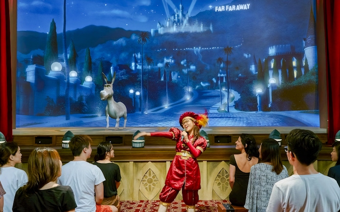Donkey from Shrek interacts with audience during a stage performance in Far Far Away.