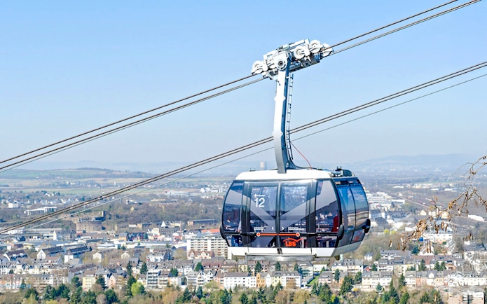 Koblenz Cable Car over cityscape with distant hills in Germany.
