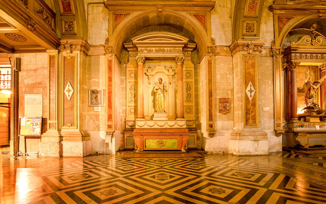 Sculpture and ornate columns inside Santiago Cathedral.